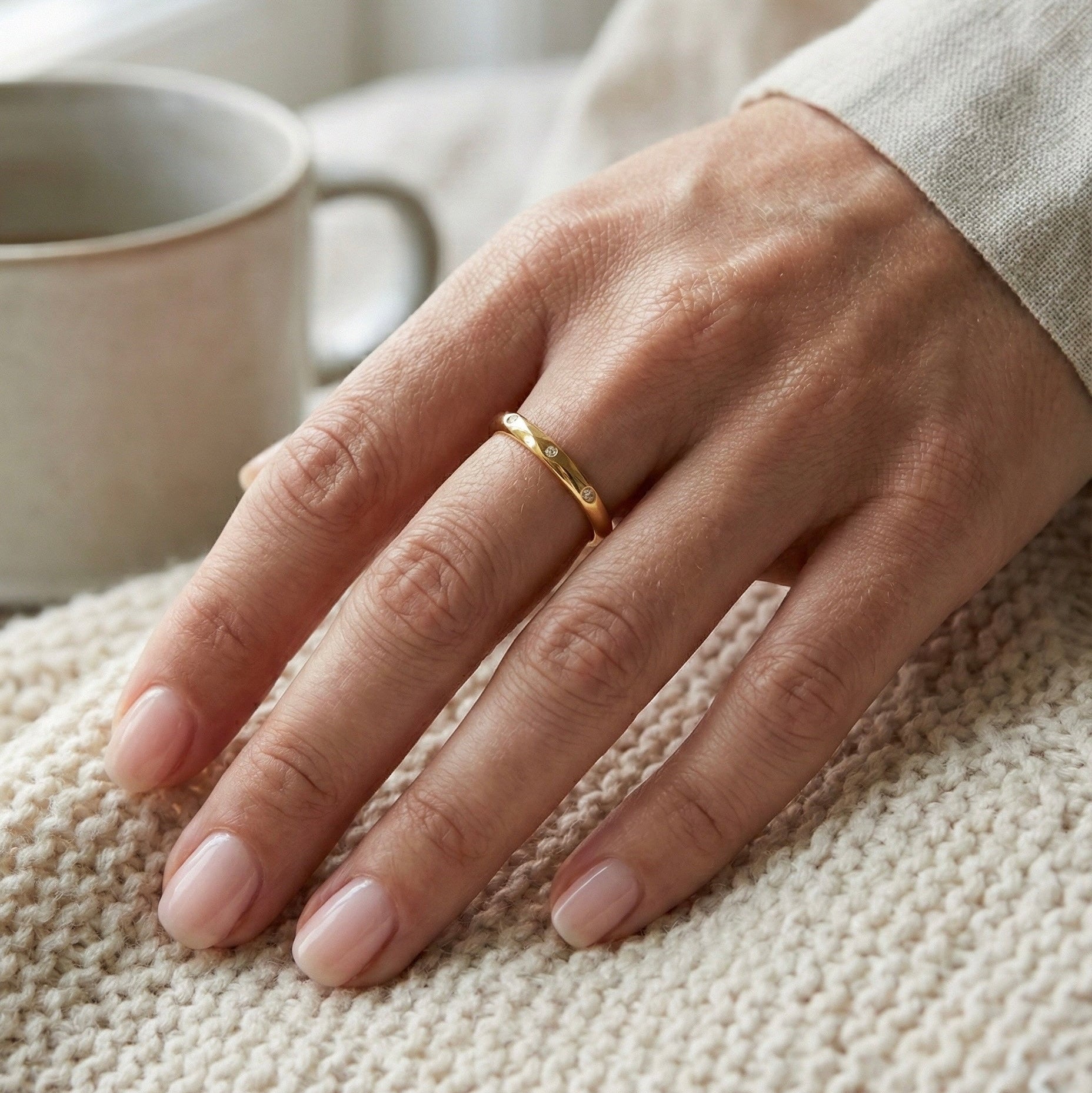 Aveline Ring worn on a hand in a lifestyle image