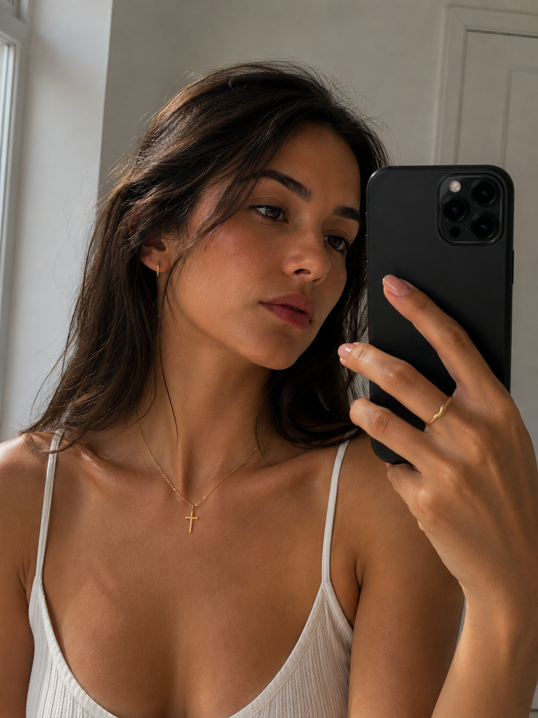 Celeste Cross Necklace worn in a Lumé Lumé lifestyle image