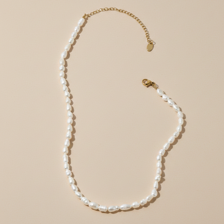 Lumière Pearl Necklace freshwater pearl and gold chain flat lay