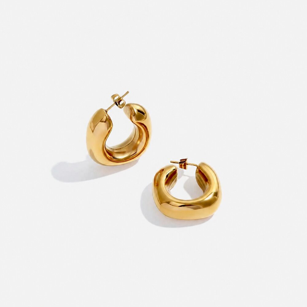 Luna Curve Hoops sculpted gold earrings by Lumé Lumé