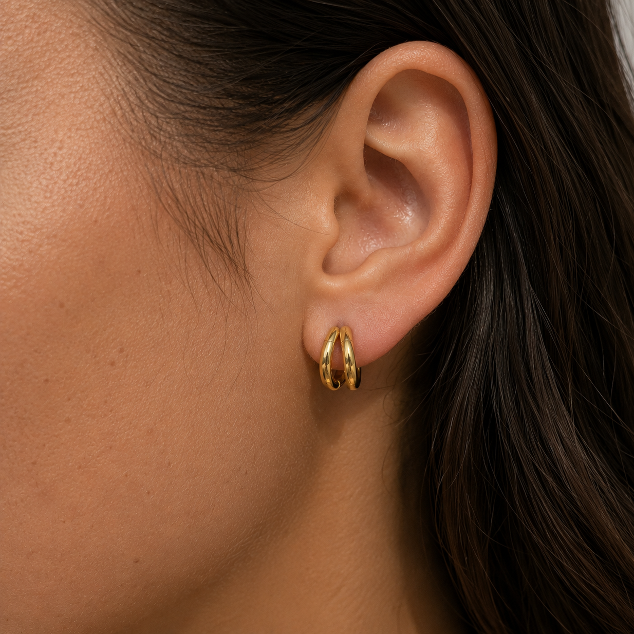 Nova Duo Hoops worn in a close-up Lumé Lumé lifestyle image