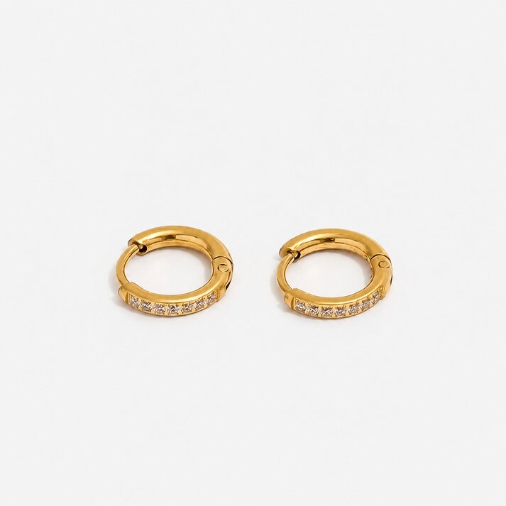Serene Pavé Huggies gold earrings with clear stones by Lumé Lumé