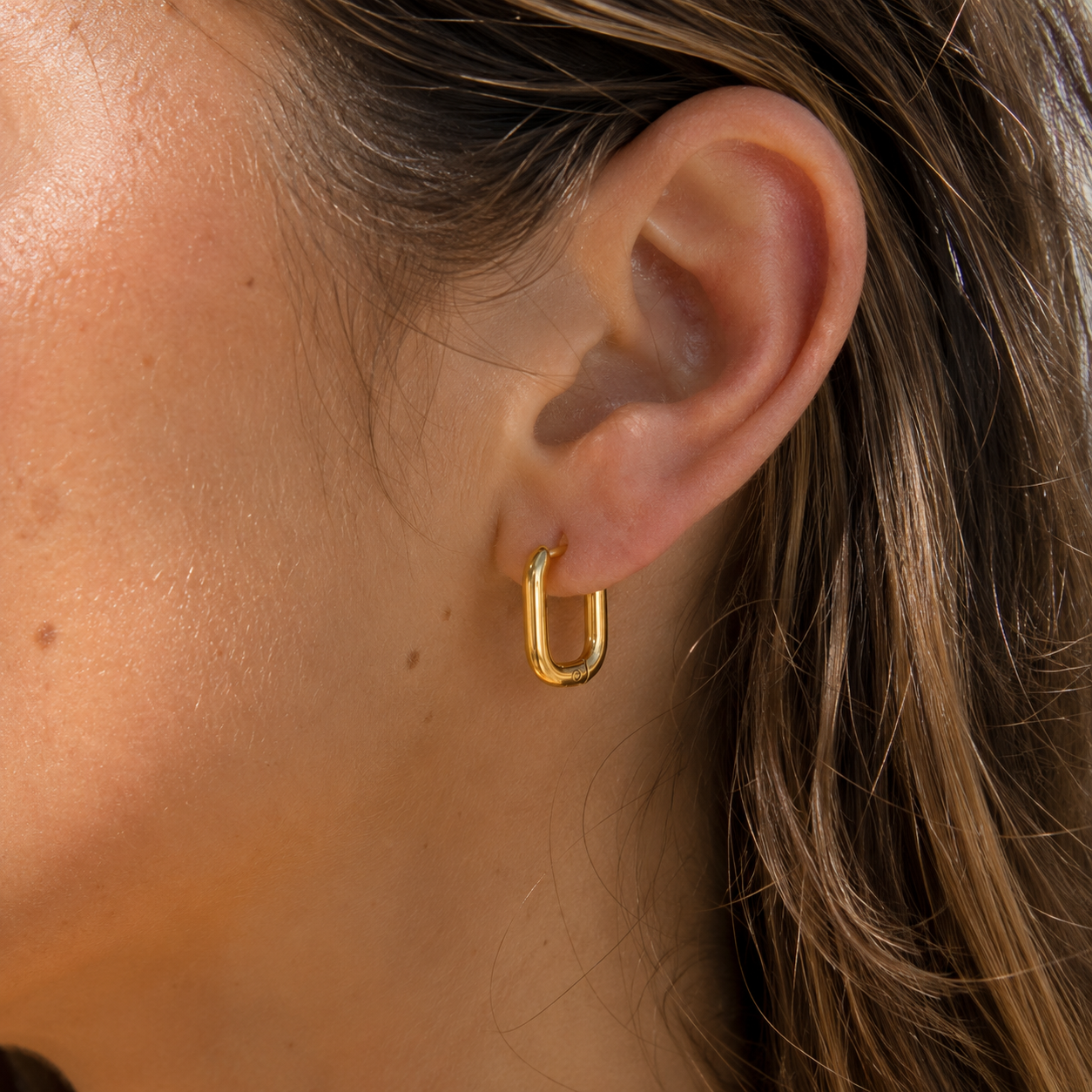 Sloane Rectangle Hoops worn in a Lumé Lumé lifestyle image