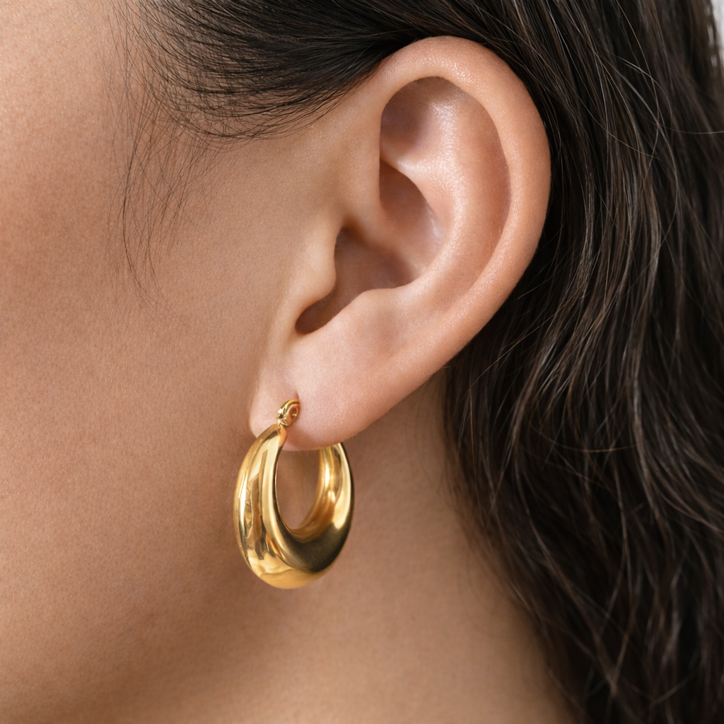 Solara Drop Hoops worn in a Lumé Lumé lifestyle image