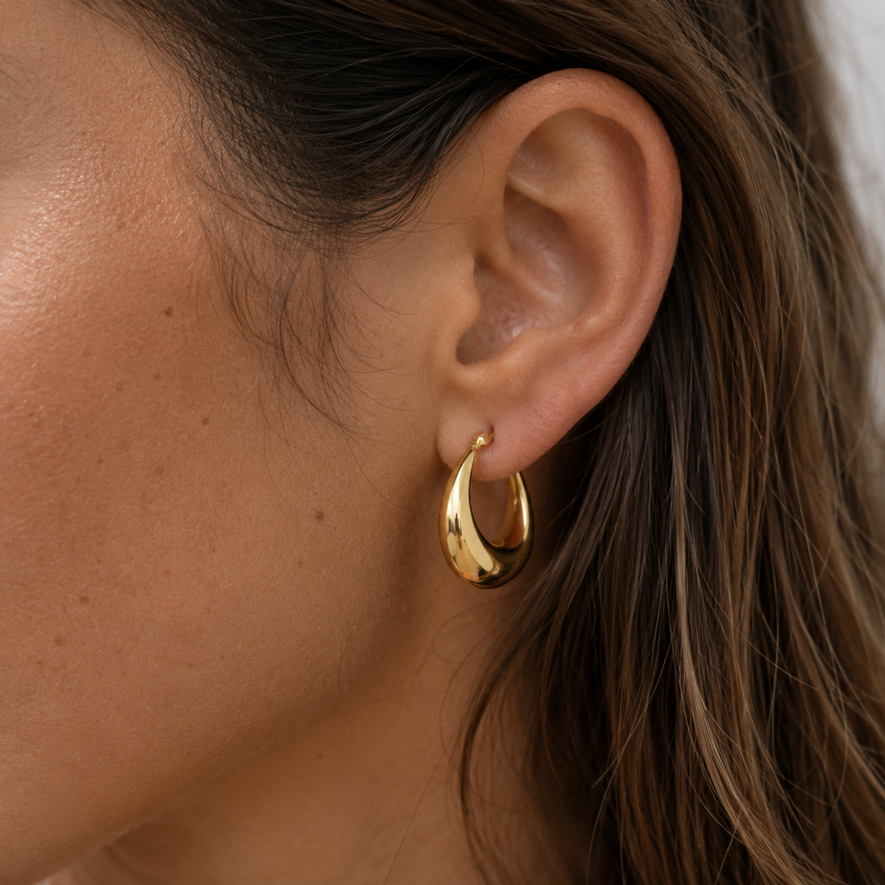 Solara Hoops worn in a Lumé Lumé lifestyle image